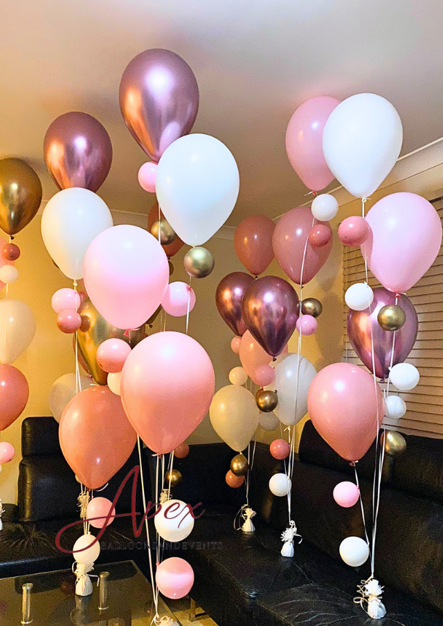 Helium Cascade Bouquet, a tiered helium balloon arrangement with cascading accent minis
